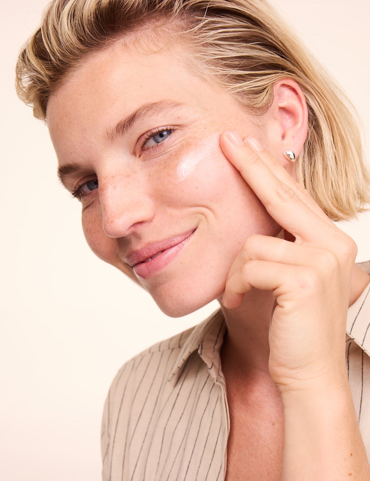 Woman applying Lavera Basis Sensitive Calming Night Cream
