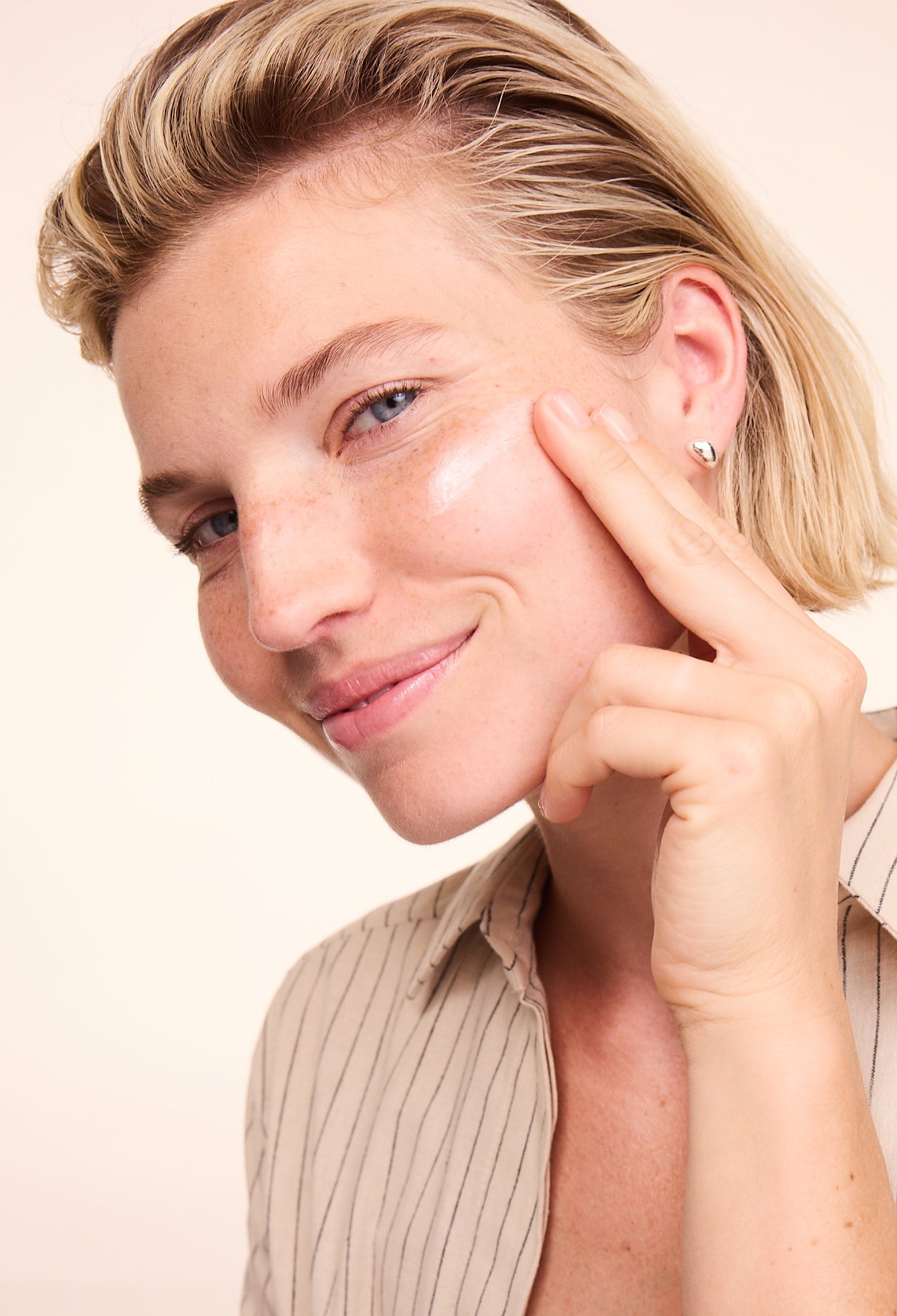 Woman applying Lavera Basis Sensitive Calming Night Cream