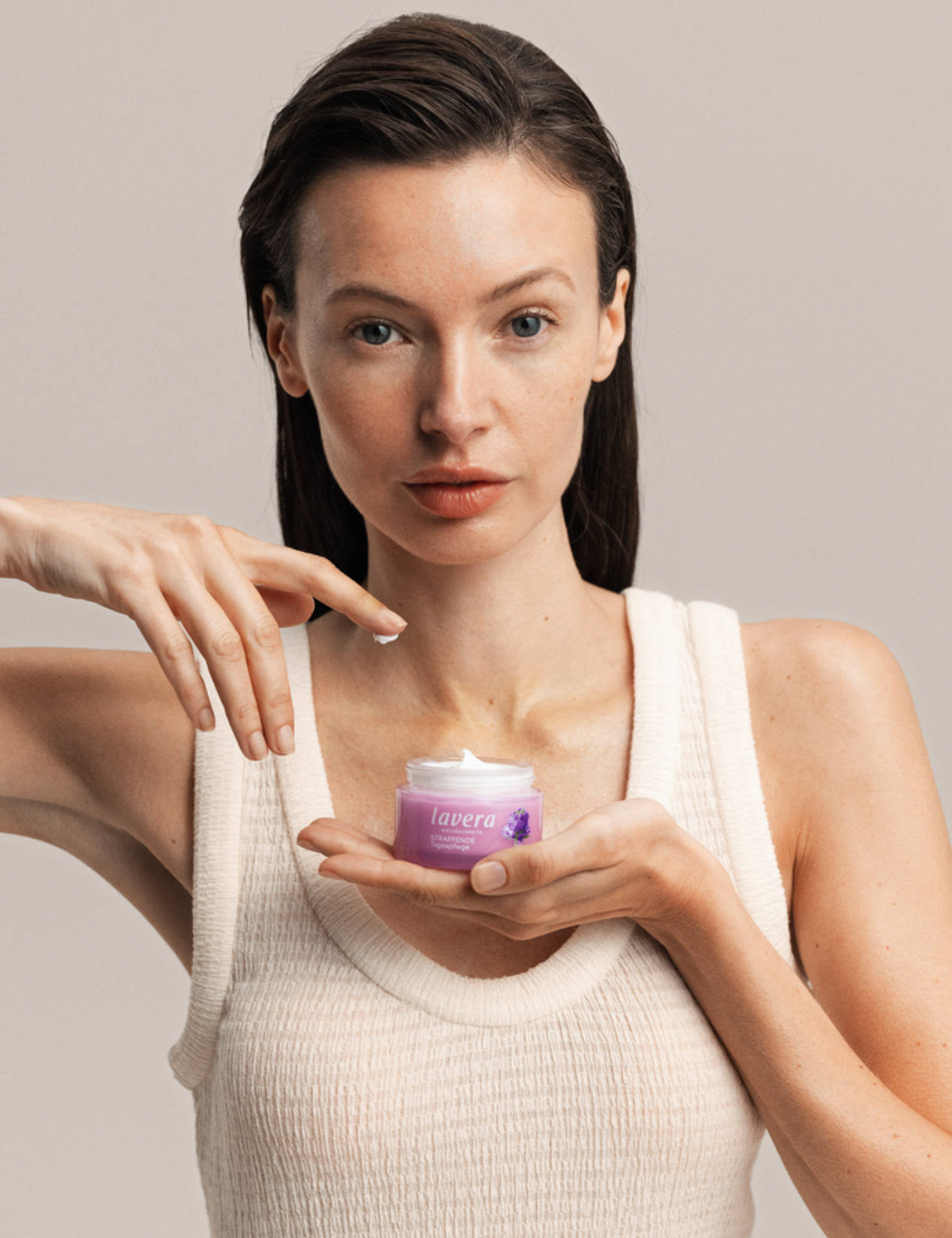 Woman holding Lavera Firming Day Cream