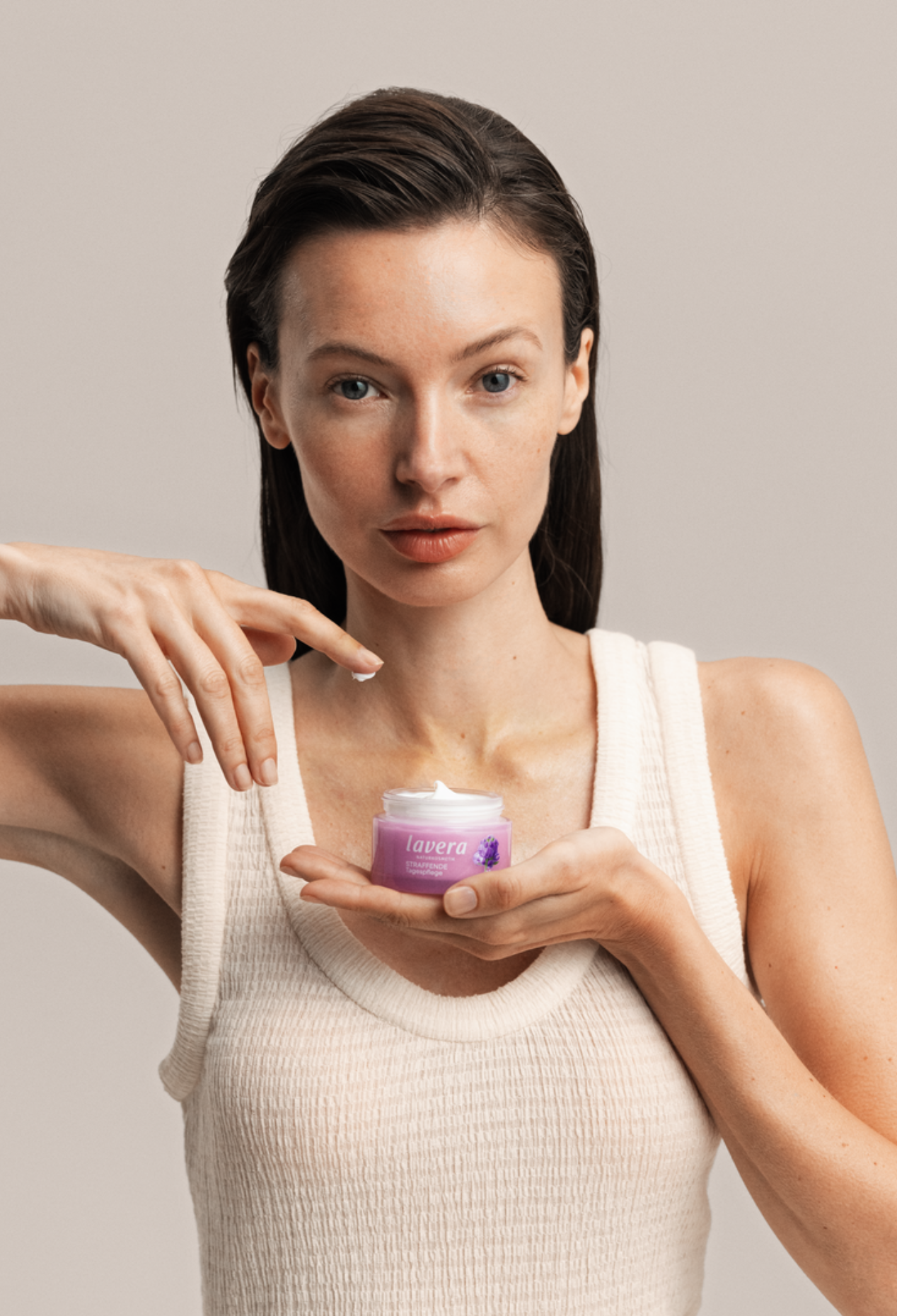 Woman holding Lavera Firming Day Cream