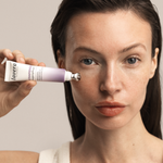 Woman applying Lavera Firming Eye Cream