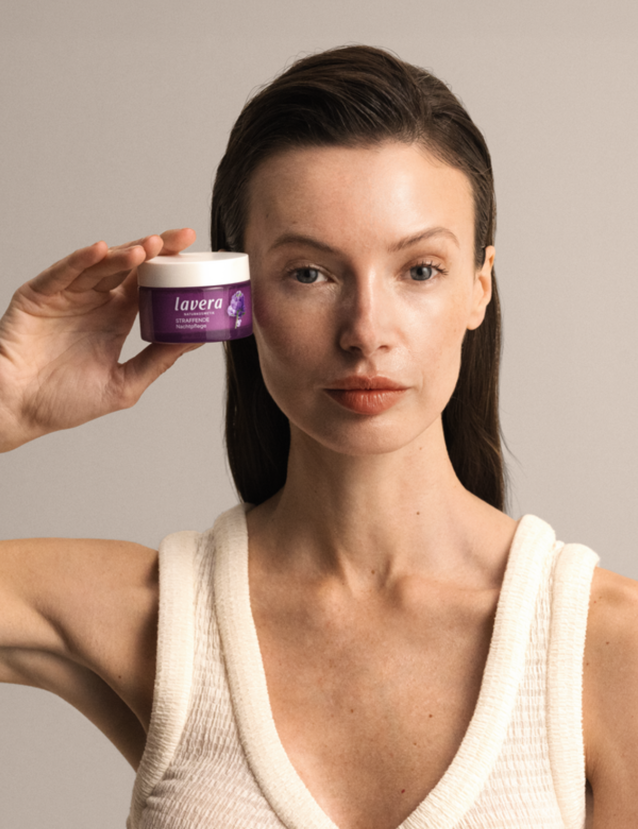 Woman holding Lavera Firming Night Cream