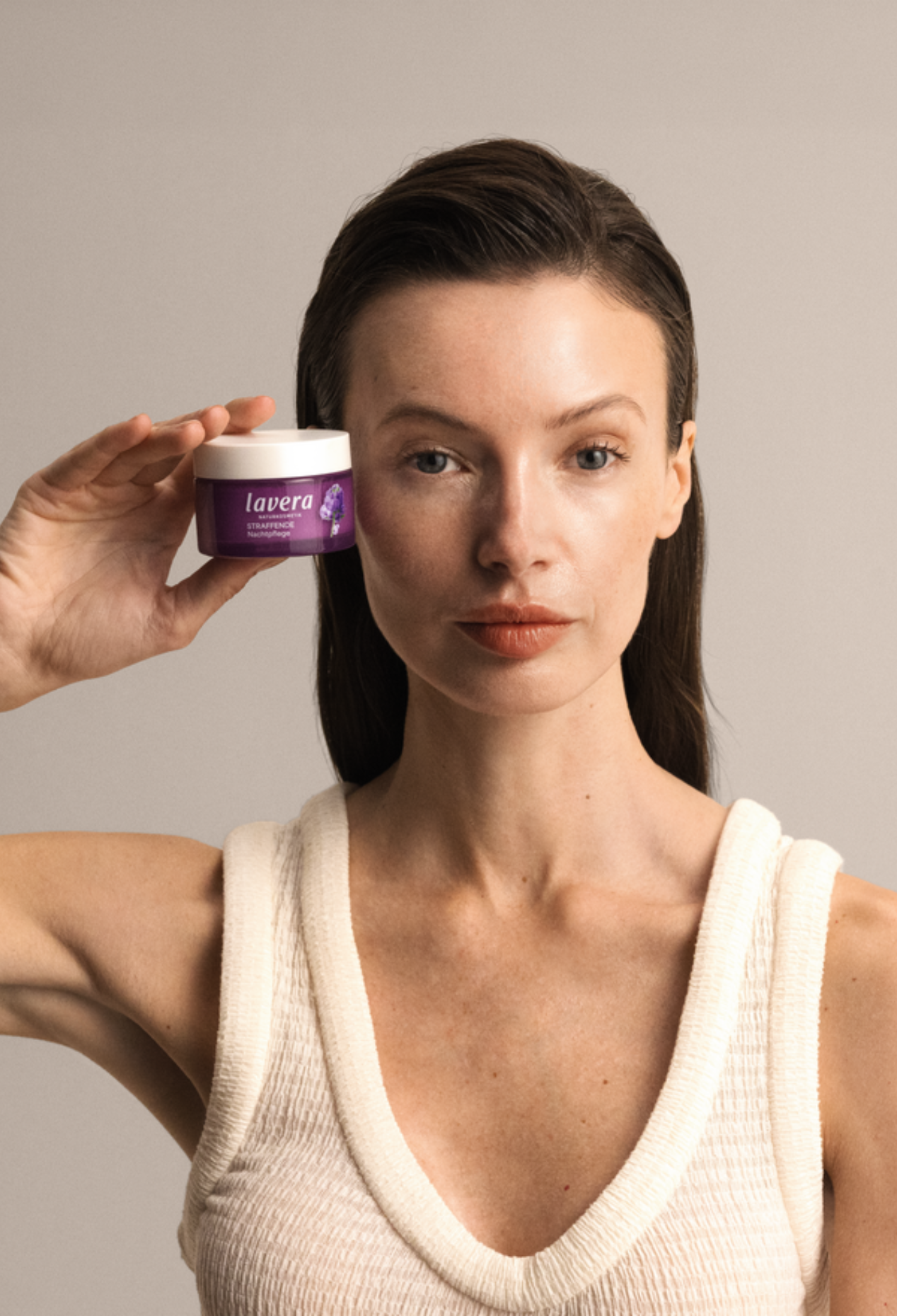 Woman holding Lavera Firming Night Cream