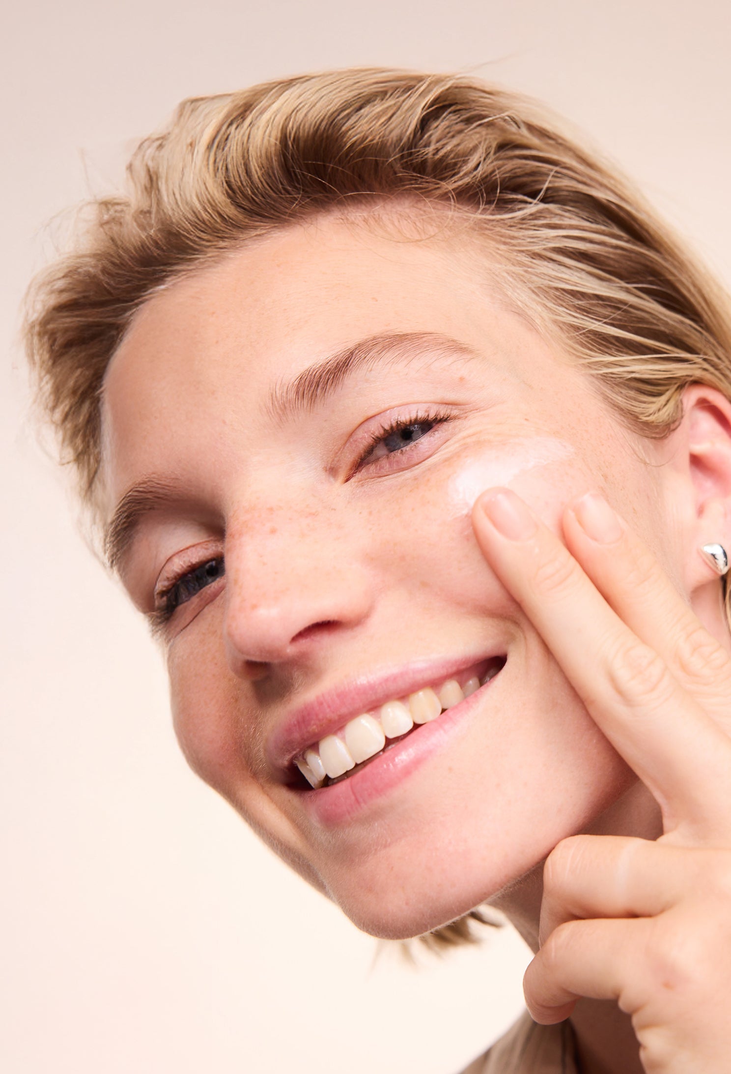 Woman applying Lavera Basis Sensitive Moisturising Cream
