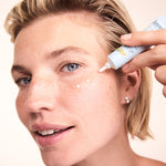 Woman applying Lavera Basis Sensitive Q10 Eye Cream