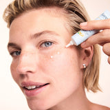 Woman applying Lavera Basis Sensitive Q10 Eye Cream