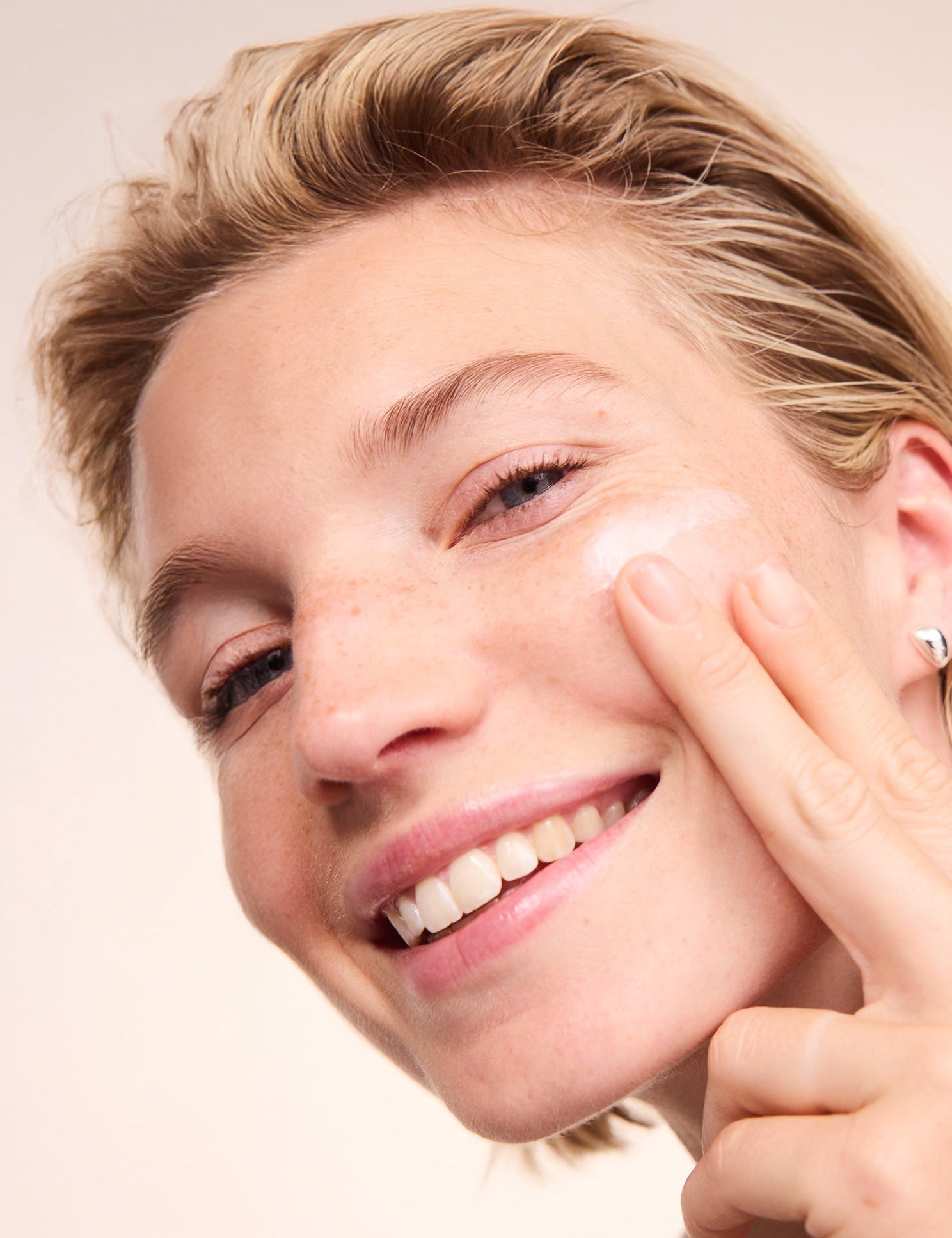 Woman applying Lavera Basis Sensitive Q10 Night Cream
