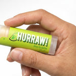 Hand holding Hurraw! Organic Lip Balm - Lime 4.8g