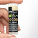 Hand holding Hurraw! Lime & Coconut Lip Balm 4.8g