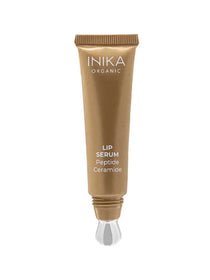 A gold tube of INIKA Organic Tinted Lip Serum - Peptide + Ceramide Clear 10ml with a silver applicator tip stands upright against a white background. The label features "LIP SERUM Peptide Ceramide" in white, showcasing this organic lip care essential.
