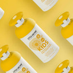 Little Urchin Kids Natural Clear Zinc Sunscreen SPF50+ 300g — yellow 300g pump bottles arranged on a yellow background.