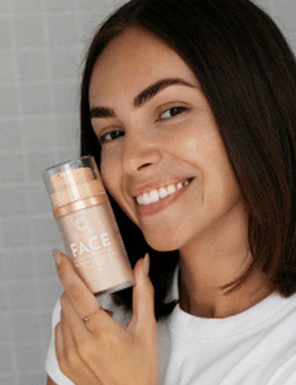 Woman holding Little Urchin tinted face sunscreen