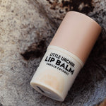 Little Urchin vanilla coconut lip balm styled with coconut