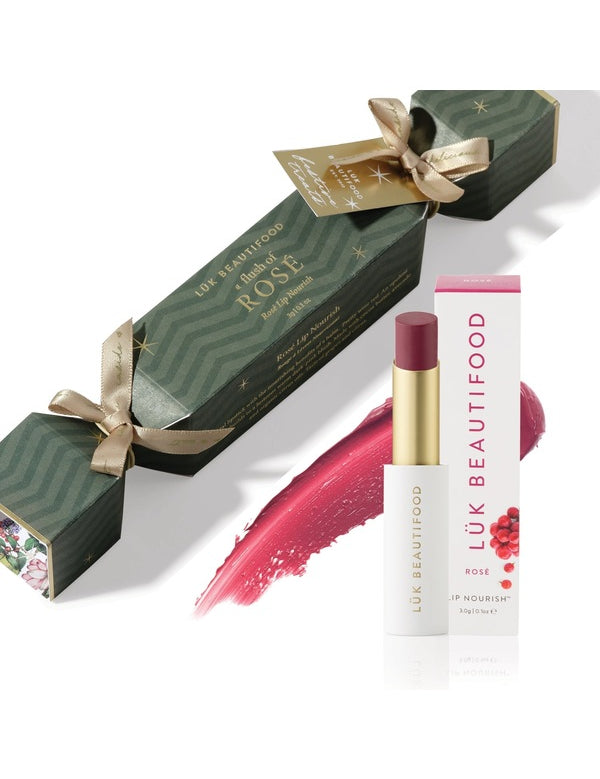 Luk Beautifood Bon Bon Rosé Lipstick Cracker gift set with green cracker packaging, Rosé Lip Nourish lipstick, white carton and a berry-pink colour swatch.