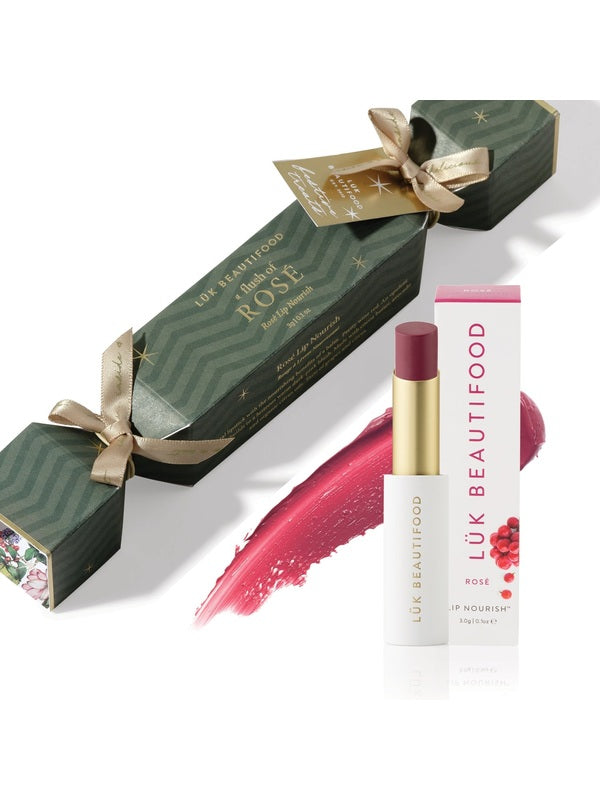 Luk Beautifood Bon Bon Rosé Lipstick Cracker gift set with green cracker packaging, Rosé Lip Nourish lipstick, white carton and a berry-pink colour swatch.