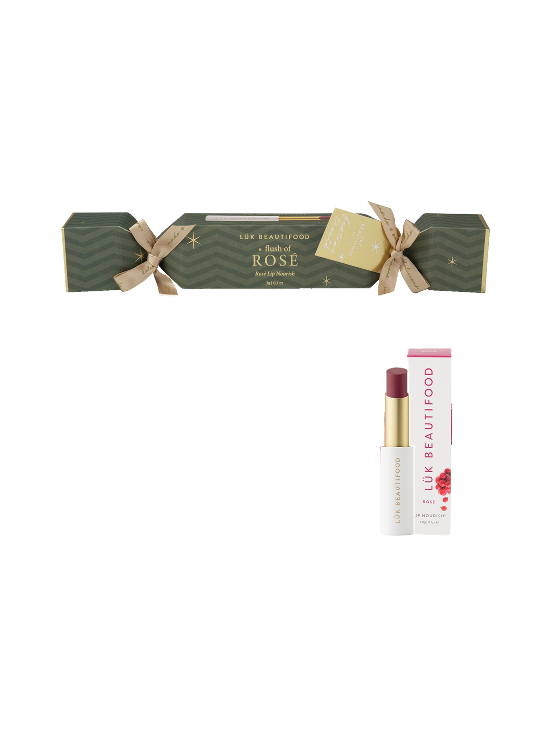Luk Beautifood Bon Bon Rosé Lipstick Cracker on white: dark green Christmas cracker tied with gold ribbons, alongside an open wine-red lipstick and its white carton.