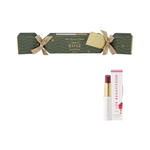 Luk Beautifood Bon Bon Rosé Lipstick Cracker on white: dark green Christmas cracker tied with gold ribbons, alongside an open wine-red lipstick and its white carton.