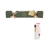 Luk Beautifood Bon Bon Rosé Lipstick Cracker on white: dark green Christmas cracker tied with gold ribbons, alongside an open wine-red lipstick and its white carton.