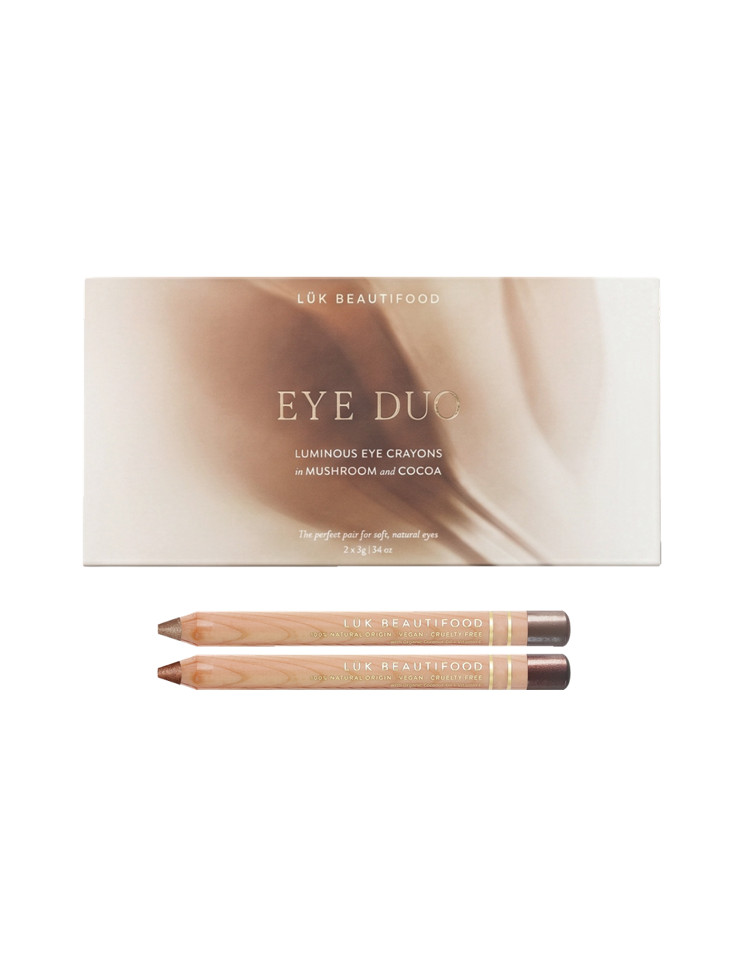 Luk Beautifood Warm Cocoa Luminous Eye Crayon Duo on white: gift box above two wooden eye pencils in rosy-taupe Mushroom and bronze-brown Cocoa.