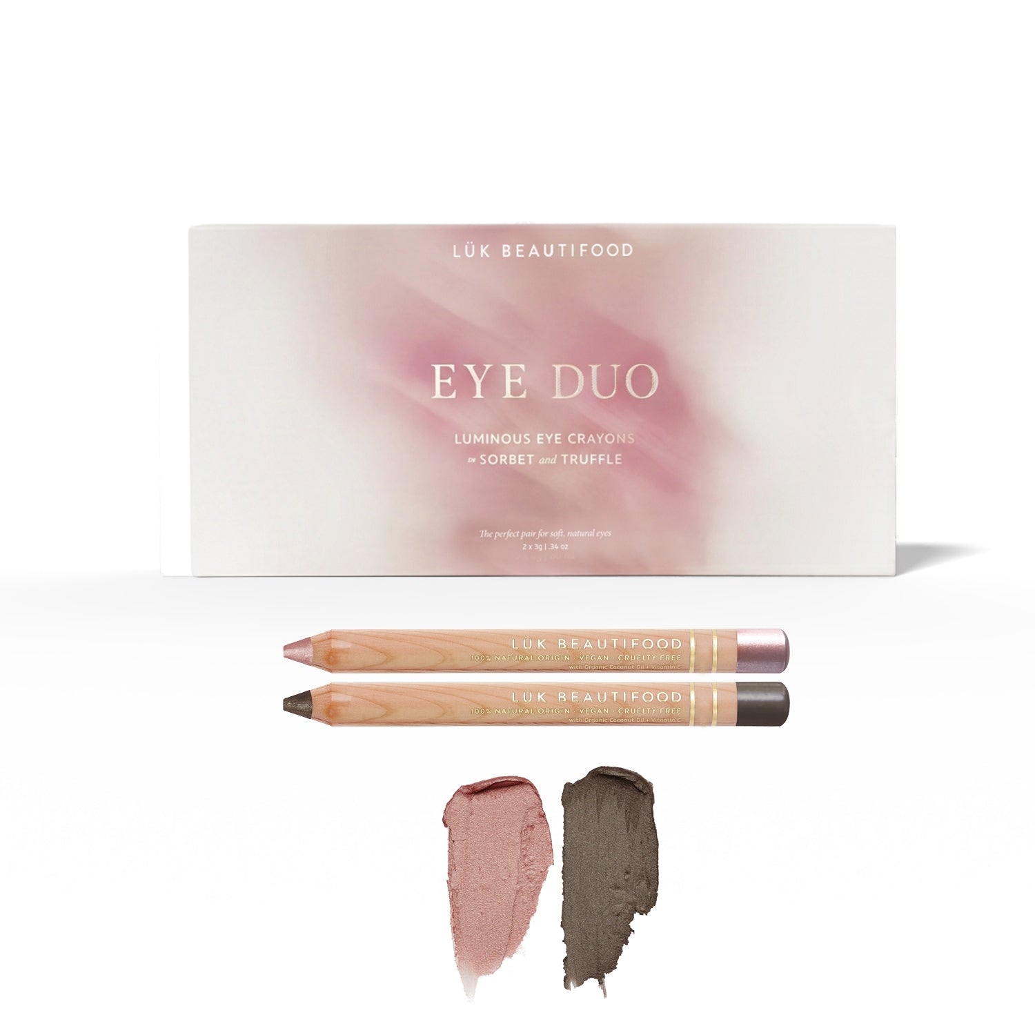Soft Taupe Luminous Eye Crayon Duo: gift box, Sorbet and Truffle wooden crayons, and matching dusty-rose and deep charcoal-taupe swatches.