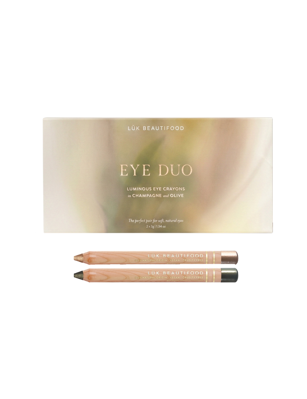 Luk Beautifood Luminous Eye Crayon Duo in Golden Olive: a gold-green gift box above two wooden eye crayons in Champagne and Olive.