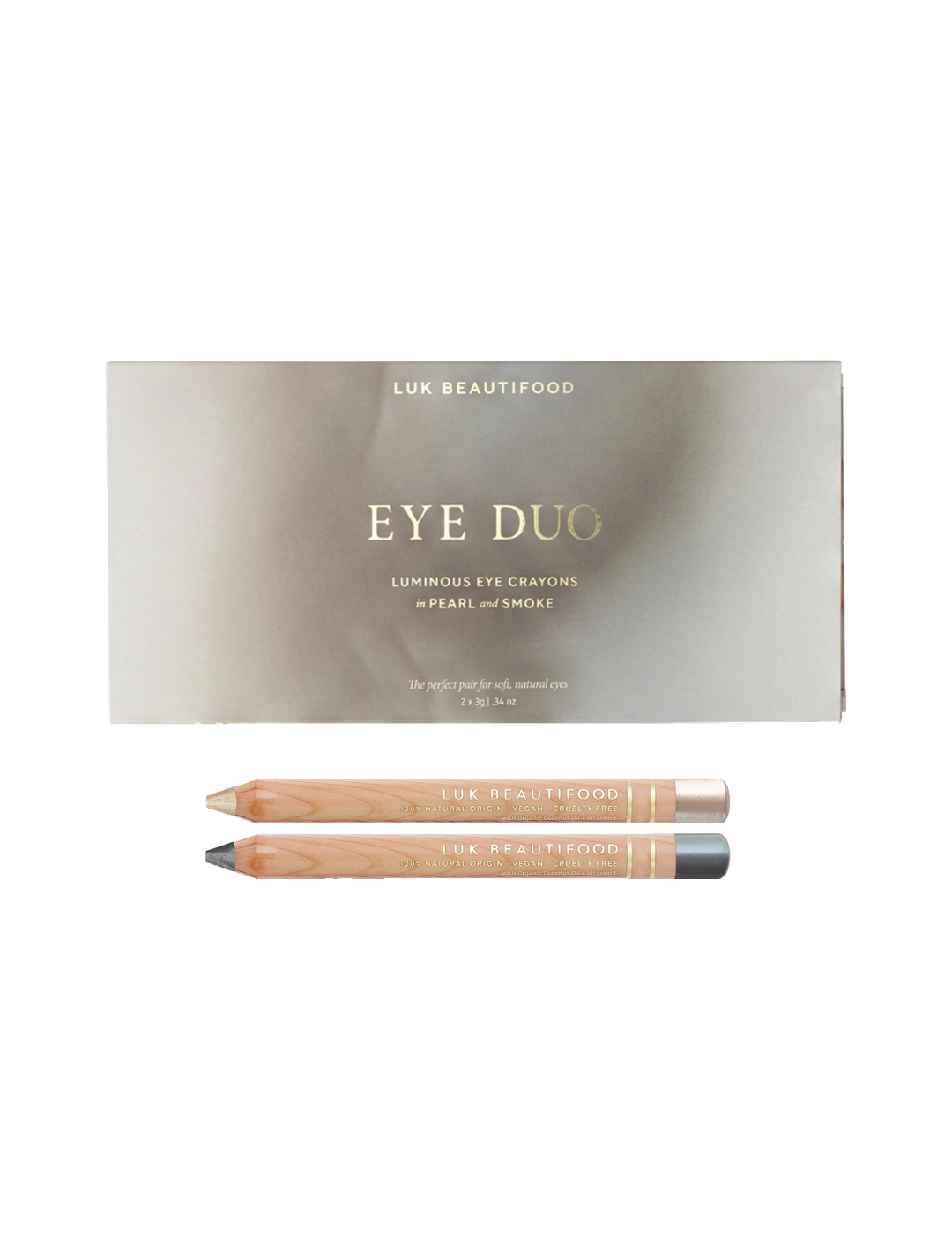 Luk Beautifood Soft Smoke Luminous Eye Crayon Duo on white: gift box above two wooden eye pencils in pale vanilla-gold Pearl and deep silver-grey Smoke.