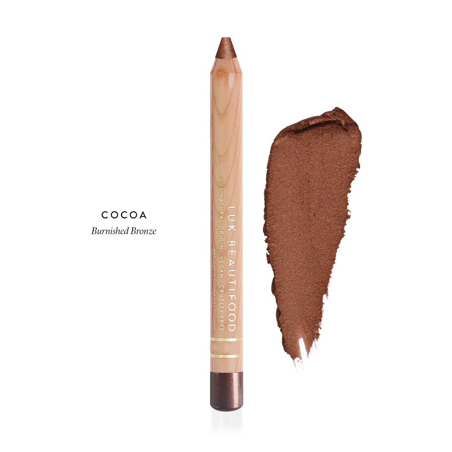 Luk Beautifood Luminous Eye Crayon in Cocoa, a wooden pencil beside a warm bronze-brown swatch labelled Burnished Bronze.