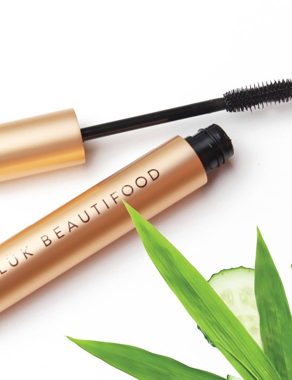 Open Luk Beautifood Lash Nourish Mascara styled with cucumber and botanical leaves