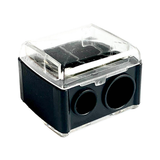 Black rectangular Luk Beautifood lip-crayon sharpener with a clear lid and two circular sharpening holes of different sizes.