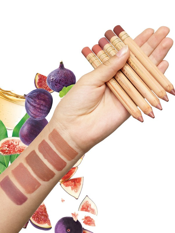 Luk Beautifood Lipstick Crayons held across a hand with all five shades swatched on an arm