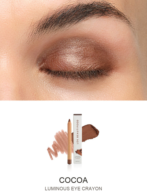 Luk Beautifood Luminous Eye Crayon in Cocoa: close-up of the shade on an eyelid above the matching crayon, carton and pigment swatch. Cocoa is labelled at the bottom.