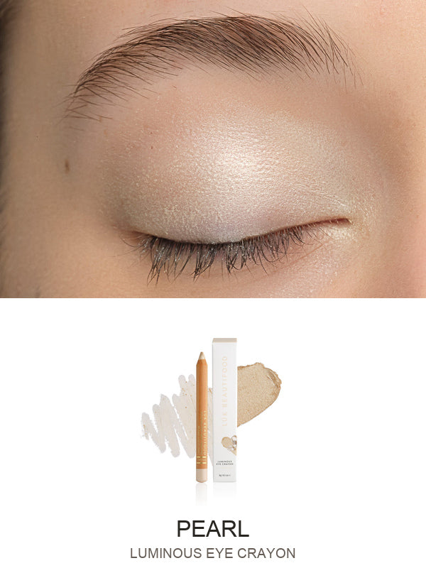 Luk Beautifood Luminous Eye Crayon in Pearl: close-up of the shade on an eyelid above the matching crayon, carton and pigment swatch. Pearl is labelled at the bottom.