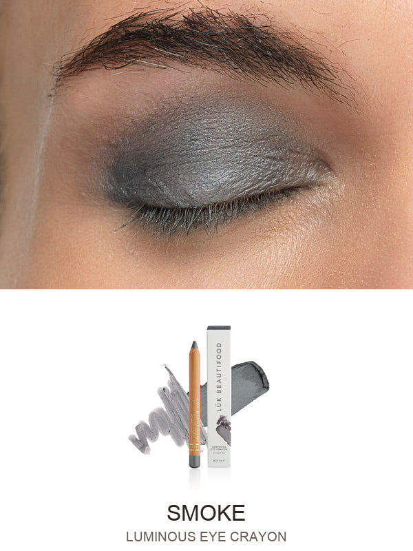 Luk Beautifood Luminous Eye Crayon in Smoke: close-up of the shade on an eyelid above the matching crayon, carton and pigment swatch. Smoke is labelled at the bottom.