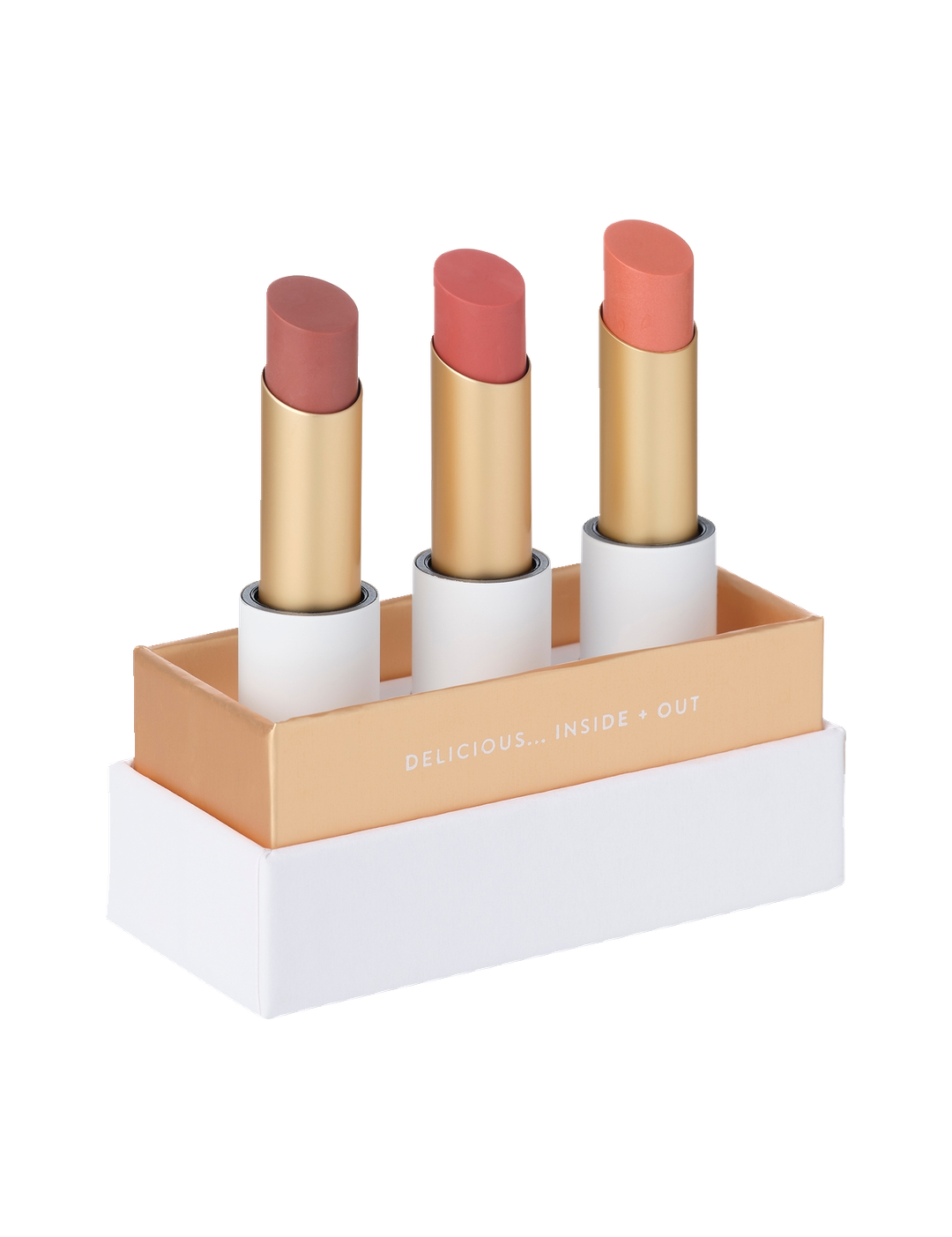 Luk Beautifood Lip Nourish Trio in Perfect Nudes: three uncapped lipsticks in Tea Rose, Nude Pink and Peach Melon, standing in an open white and gold presentation box.