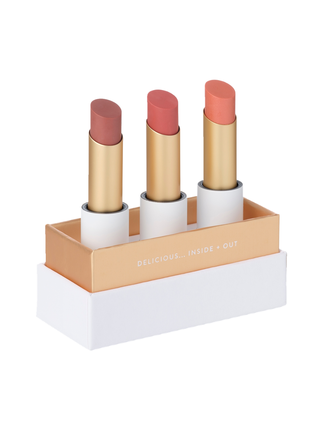 Luk Beautifood Lip Nourish Trio in Perfect Nudes: three uncapped lipsticks in Tea Rose, Nude Pink and Peach Melon, standing in an open white and gold presentation box.