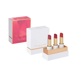 Luk Beautifood Luscious Reds Lip Nourish Trio on white: Rosé, Cherry Plum and Cranberry Citrus lipsticks in an open white and gold gift box beside the lid and pink-and-gold sleeve.