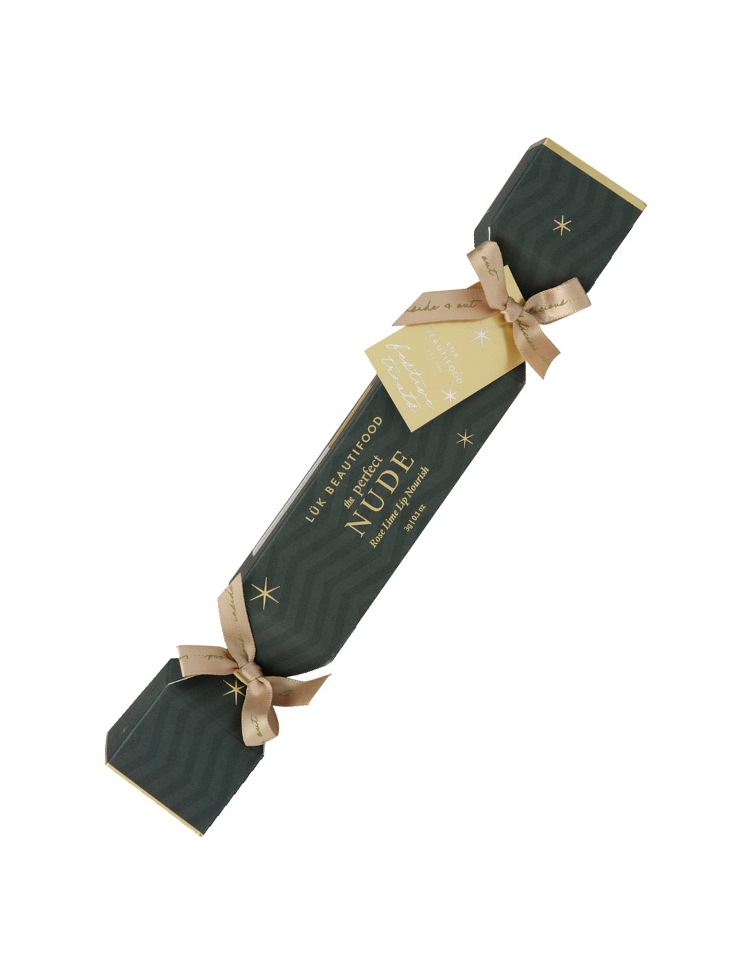 Single Luk Beautifood Rose Lime lip bonbon, a dark green Christmas cracker with gold ribbon bows and a gift tag, shown diagonally on white. The packaging reads The Perfect Nude.