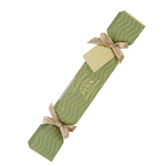 Single Luk Beautifood Guava Blush lip bonbon, a light green Christmas cracker with gold ribbon bows and a gift tag, shown diagonally on white. The packaging reads Soft Buttery Pink.