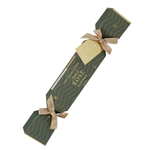 Single Luk Beautifood Rosé lip bonbon, a dark green patterned Christmas cracker with gold ribbon bows and a gift tag, shown diagonally on white. The packaging reads Flush of Rosé.