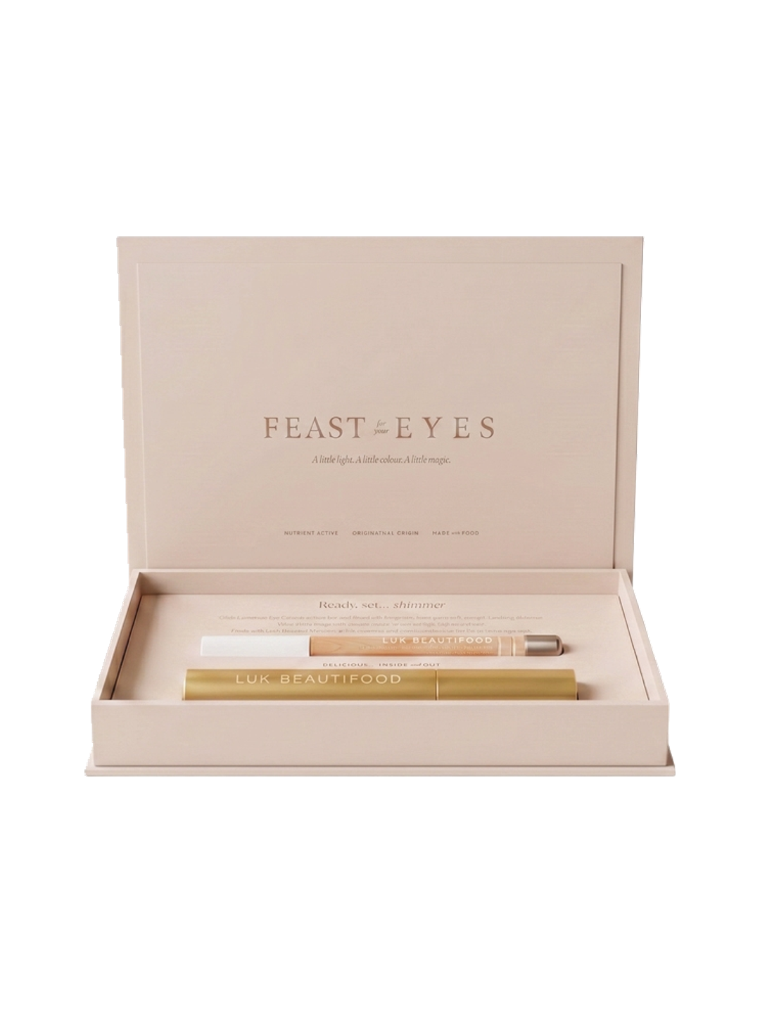 Luk Beautifood Feast for your Eyes Black Tea and Pearl gift set in one open cream gift box, with the lid raised above the gold mascara tube and pale eye crayon.