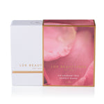 Luk Beautifood Lip Nourish Trio Perfect Nudes gift packaging, showing a closed white box with gold trim partly covered by a pink floral sleeve labelled Perfect Nudes and 3 x 3 g.
