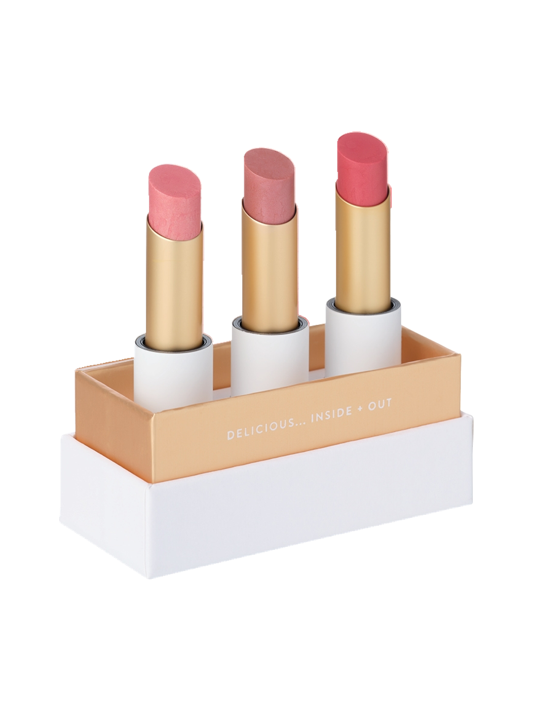 Luk Beautifood Lip Nourish Trio Buttery Pinks, with three uncapped pink lipsticks standing in a white presentation base with gold trim on a white background.
