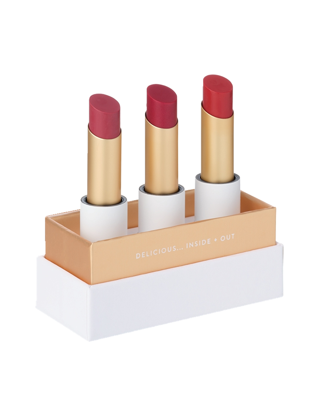 Luk Beautifood Lip Nourish Trio Luscious Reds, with three uncapped berry and red lipsticks standing in a white presentation base with gold trim on a white background.