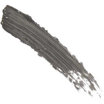 A single black brushstroke with visible bristle marks arcs diagonally across a white background, much like the precise effect of 100% Pure Green Tea Fibre Brow Builder 4.5g, with paint denser on the left and fading gently to the right.
