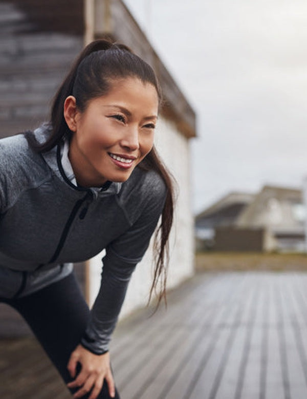 Woman pausing after exercise in official Melrose FutureLab Inflammation Modulator lifestyle imagery