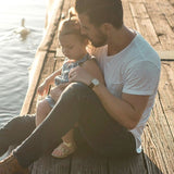 Father and child relaxing by the water in official Melrose FutureLab NAD Plus Booster lifestyle imagery