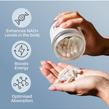 Hands holding Melrose FutureLab NAD Plus Booster and capsules against a blue background