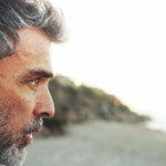 Thoughtful man outdoors in official Melrose FutureLab Neuro-Stress Modulator lifestyle imagery