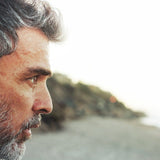 Thoughtful man outdoors in official Melrose FutureLab Neuro-Stress Modulator lifestyle imagery