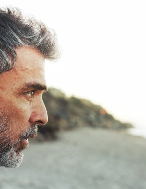 Thoughtful man outdoors in official Melrose FutureLab Neuro-Stress Modulator lifestyle imagery